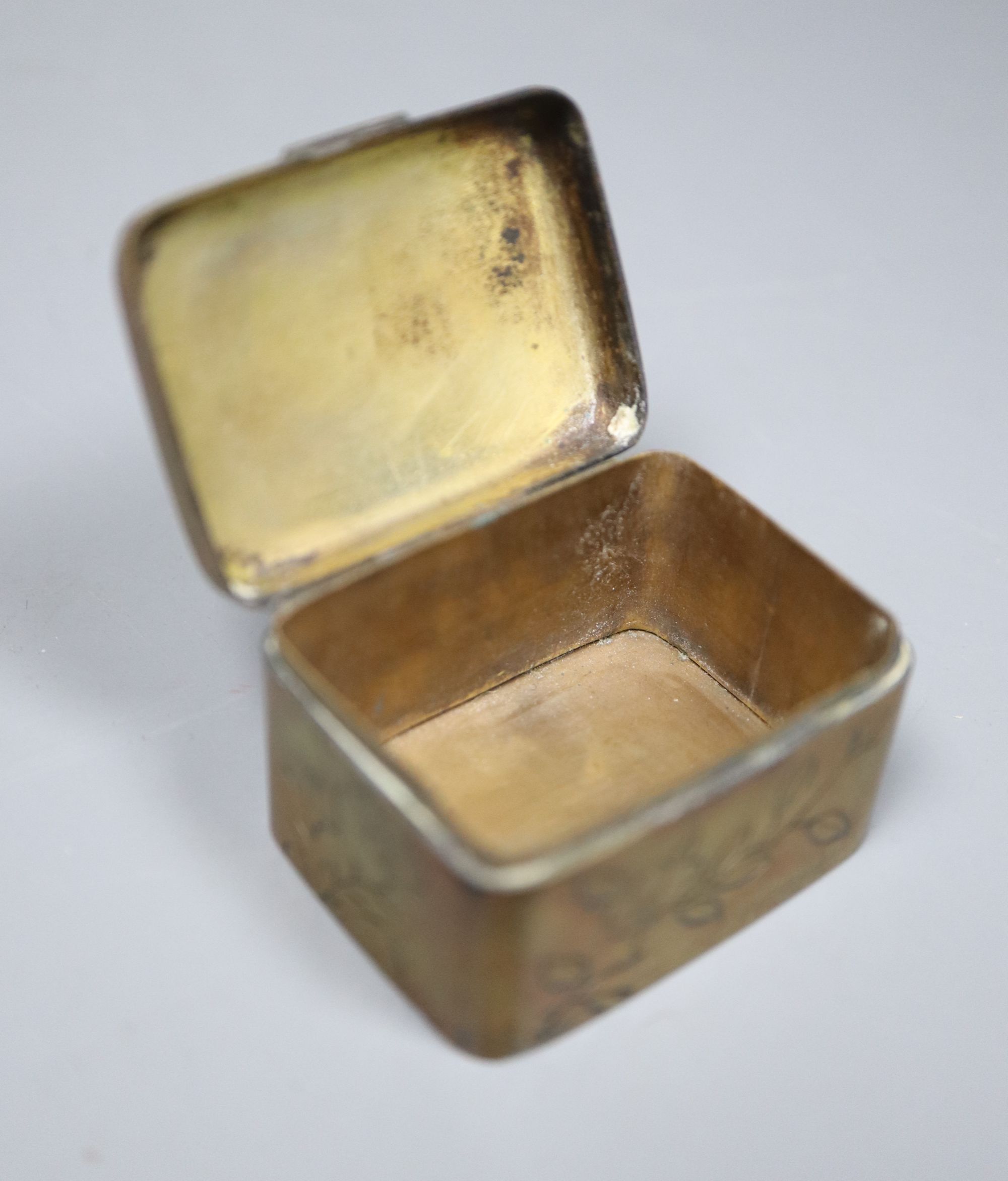 A late Victorian silver mounted tortoiseshell box, (a.f.) one other base metal box and a group of assorted metal charms.